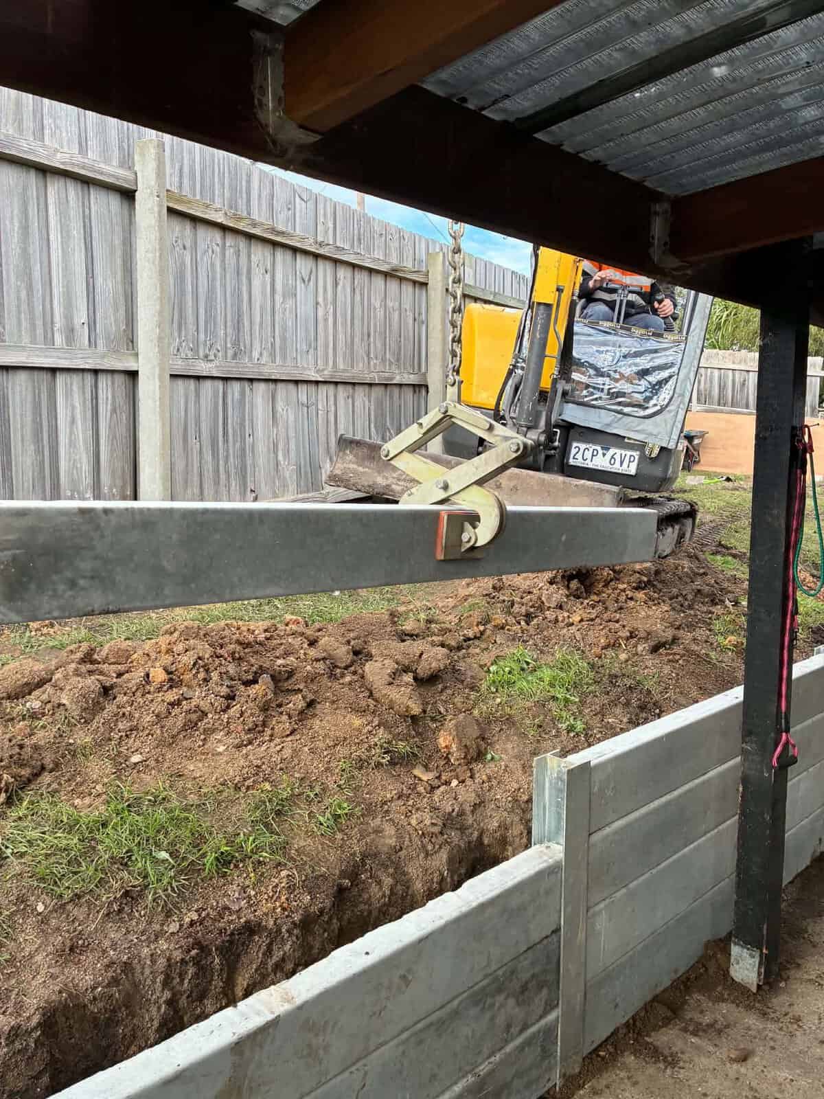 Retaining wall install mini excavator